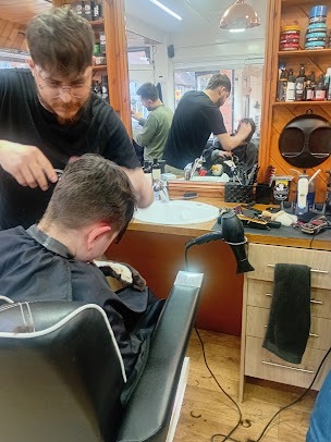 Barbers at work in the shop